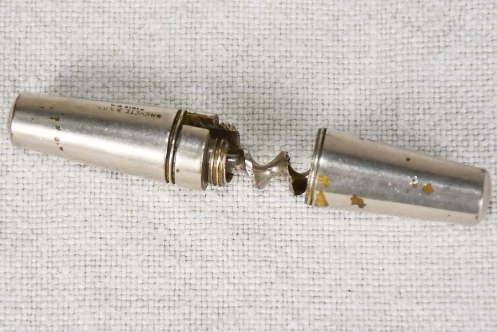 Early 20th century travel bottle opener