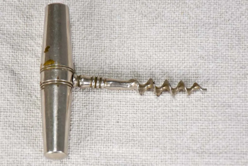 Early 20th century travel bottle opener